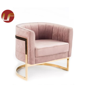 Silla de comedor tapizada moderna de acero inoxidable con reposabrazos en dorado